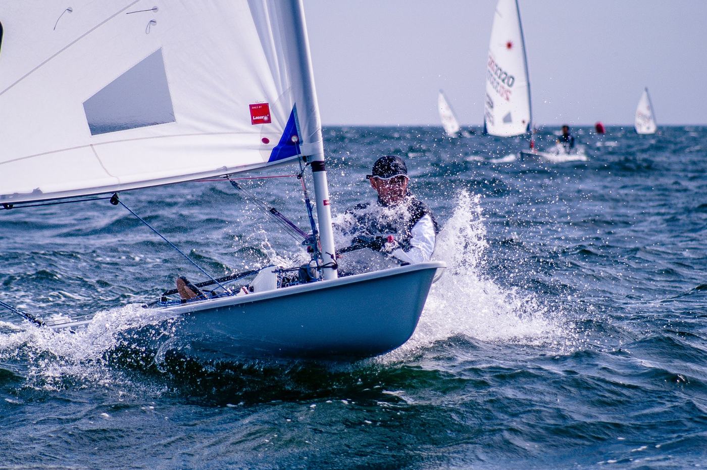 Single-handed dinghy sailor in a race